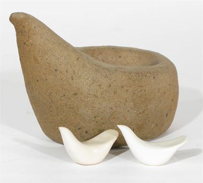 Appraisal: A stoneware bird by Walter Cole stylised form and two