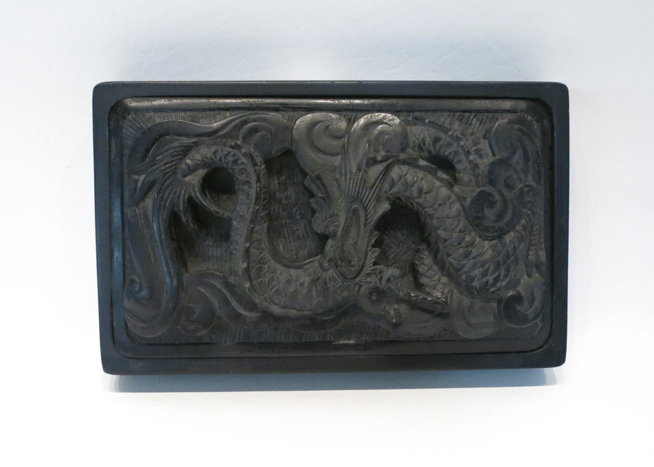 Appraisal: CHINESE DRAGON FORM INKSTONE of rectangular shape with high-relief dragon