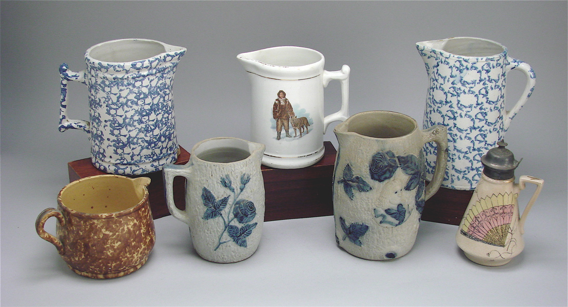 Appraisal: COLLECTION OF SEVEN PITCHERS Two blue and white scroddleware heights