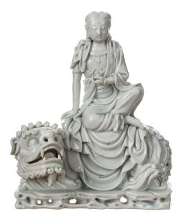 Appraisal: A DEHUA FIGURE OF GUANYIN SEATED ON A LION A