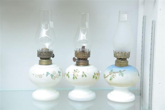 Appraisal: GROUP OF THREE PAINTED MILK GLASS MINIATURE OIL LAMPS Including