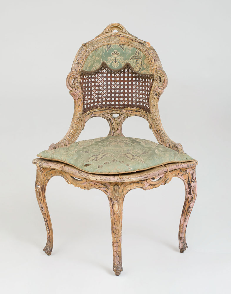 Appraisal: NORTHERN ITALIAN ROCOCO POLYCHROME-PAINTED CORNER CHAIR With caned seat and