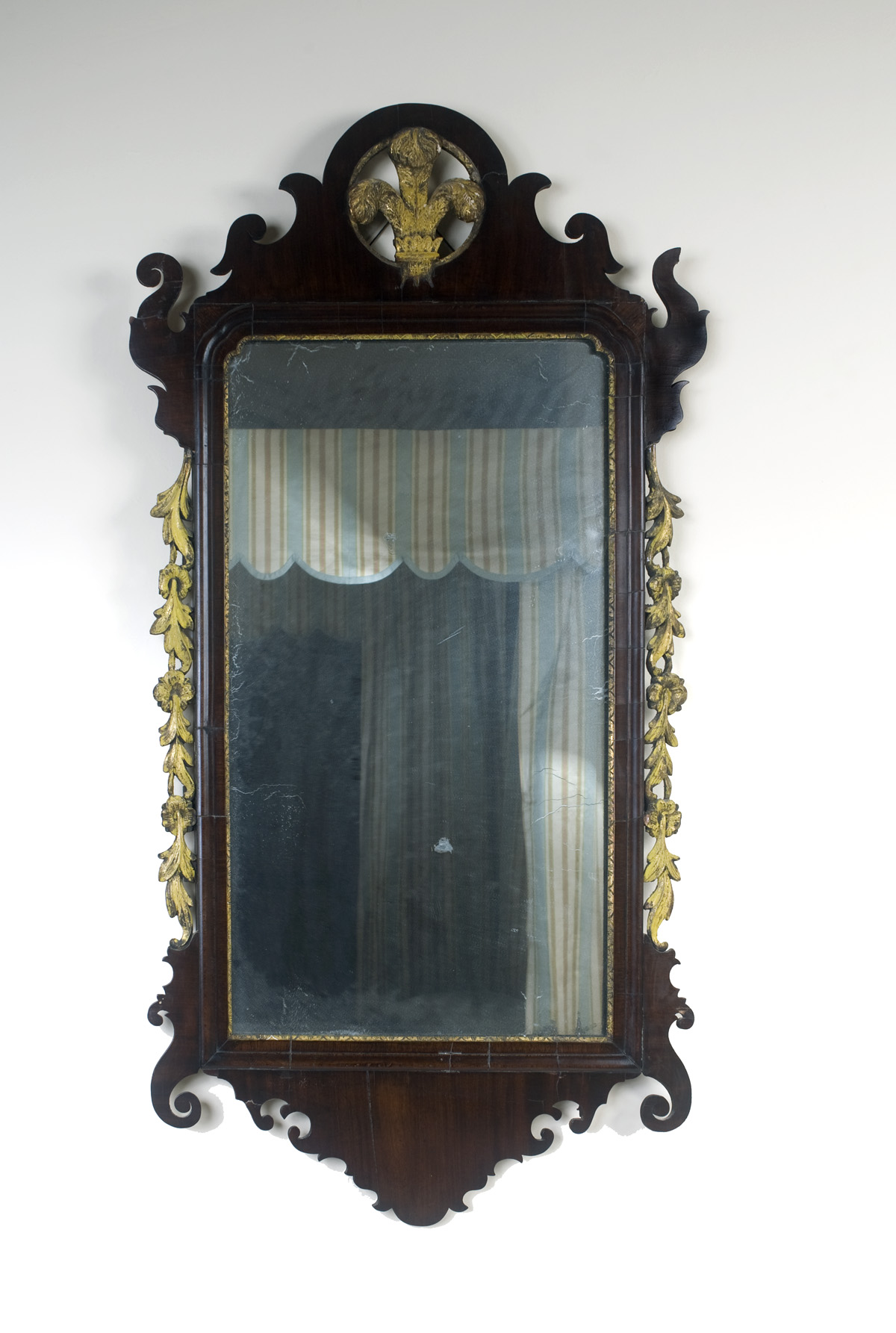 Appraisal: CHIPPENDALE STYLE MAHOGANY AND PARCEL-GILT MIRROR Height inches width inches