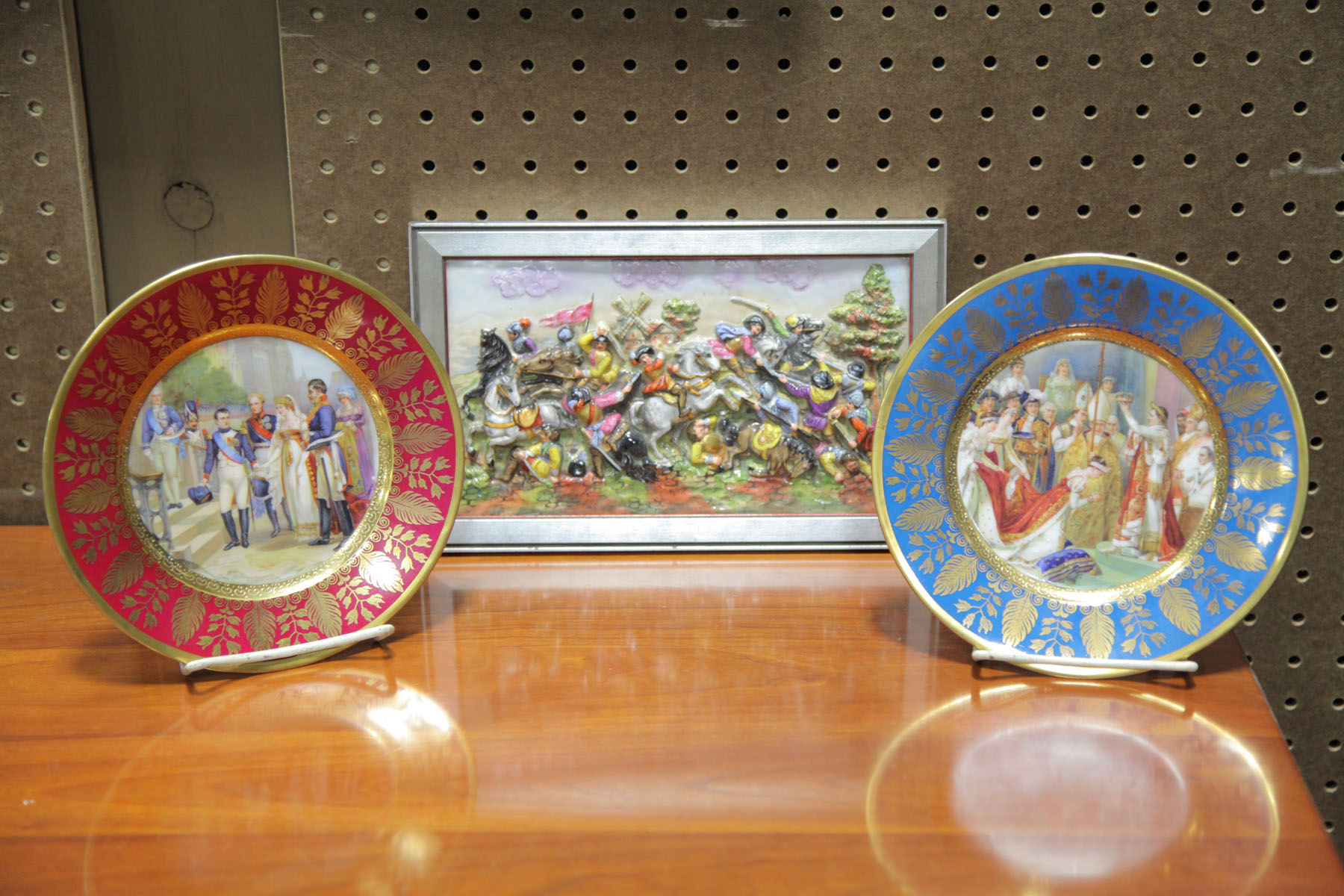 Appraisal: TWO PLATES AND A FRAMED PLAQUE IN THE CAPODIMONTE STYLE