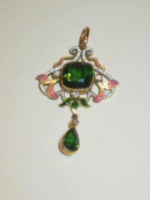 Appraisal: AN ENAMEL AND TOURMALINE PENDANT the central cushion cut tourmaline