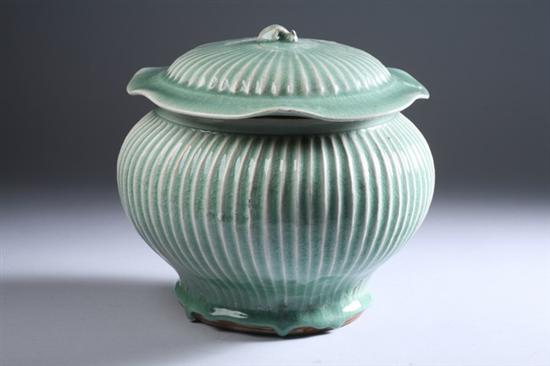 Appraisal: CHINESE CELADON PORCELAIN JAR AND COVER Ming Dynasty-style Ribbed body