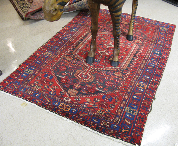 Appraisal: PERSIAN ZANJAN AREA RUG Hamadan villages region centering a red