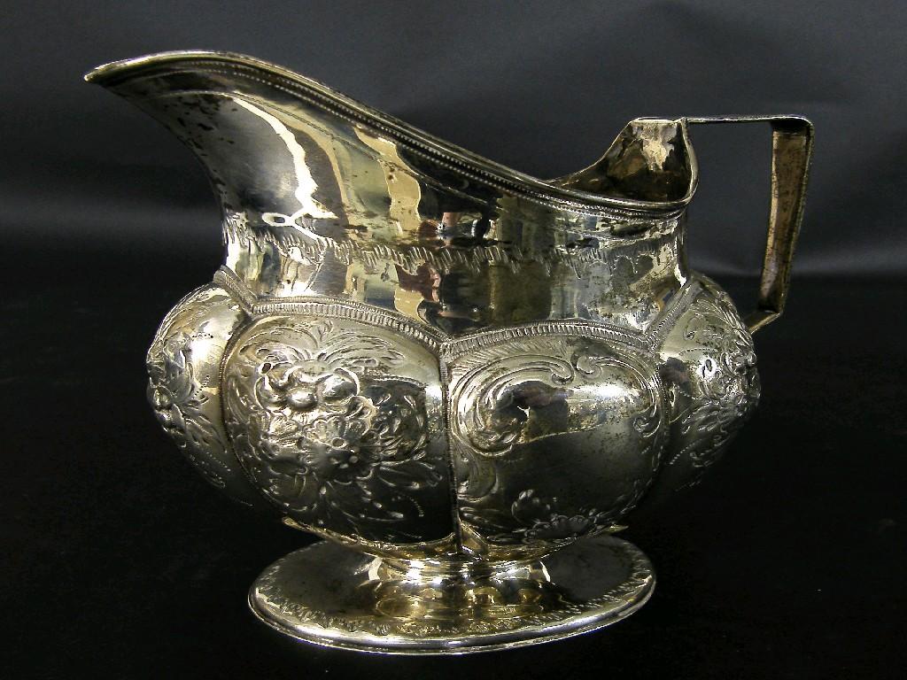 Appraisal: Georgian silver pedestal cream jug the boat shaped rim over