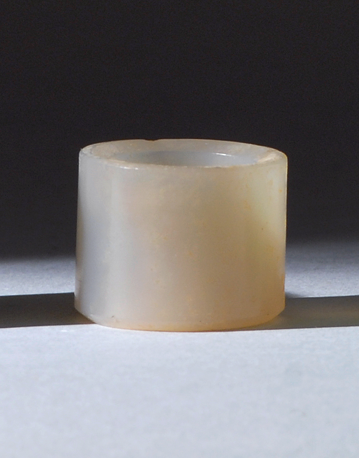 Appraisal: CHALCEDONY AGATE ARCHER'S RING th CenturyIn simple cylinder form From