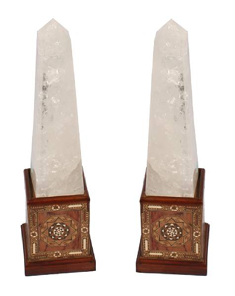 Appraisal: A pair of rock crystal obelisks on inlaid stands height