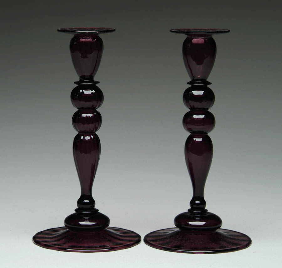 Appraisal: STEUBEN AMETHYST CANDLESTICKS Wonderful pair of Steuben candlesticks are deep