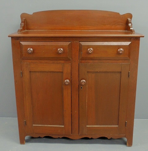 Appraisal: Pennsylvania poplar jelly cupboard c with an arched backsplash and