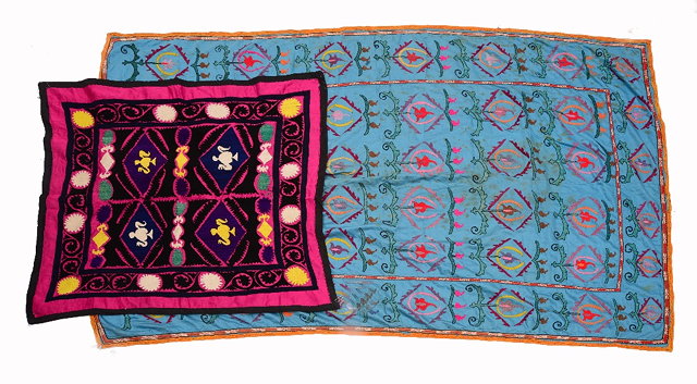 Appraisal: AN UZBEK SUZANI with repeating foliate motif on a mid