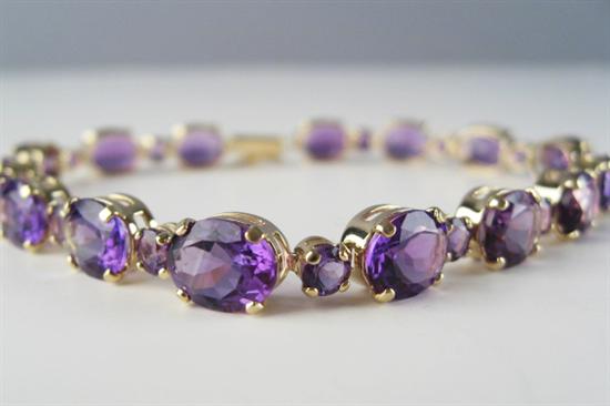 Appraisal: A Gold and Amethyst Bracelet K marked yellow gold set