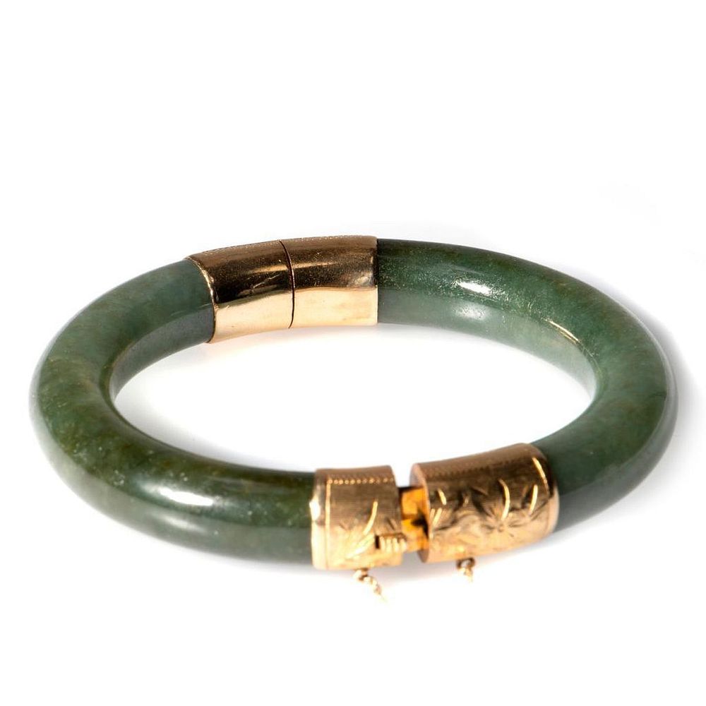 Appraisal: Jade and k gold hinged bangle bracelet the grayish green