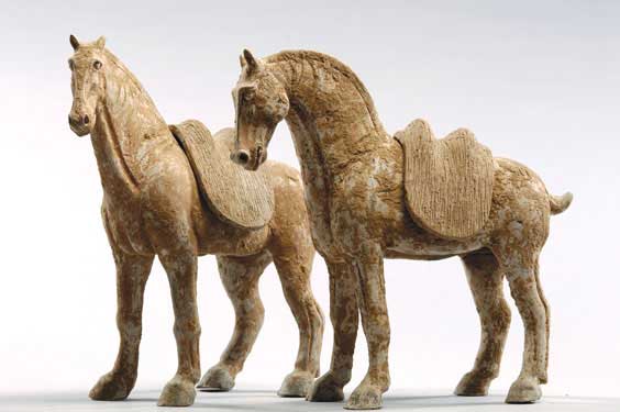 Appraisal: PAIR EARLY TANG POTTERY HORSES Pair of tall and well