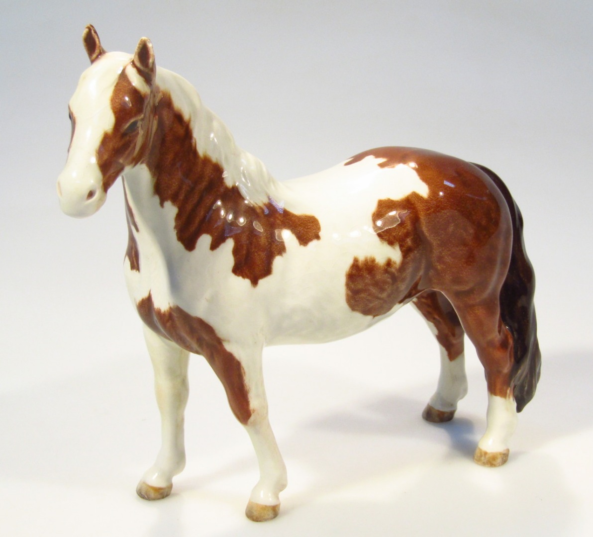 Appraisal: A Beswick figure of a dappled horse standing printed marks