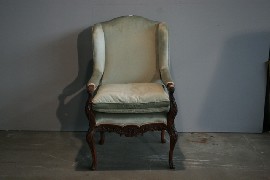 Appraisal: A Spanish carved walnut and upholstered armchair