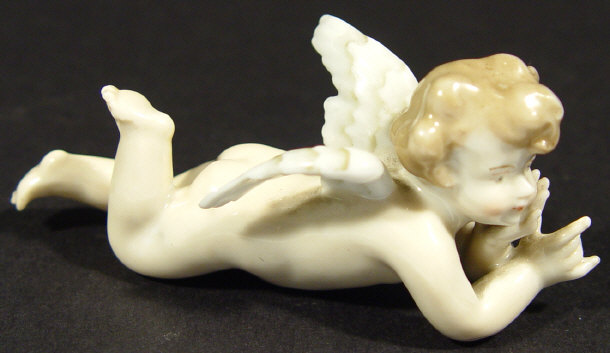 Appraisal: th Century Continental porcelain cherub with hand painted decoration blue