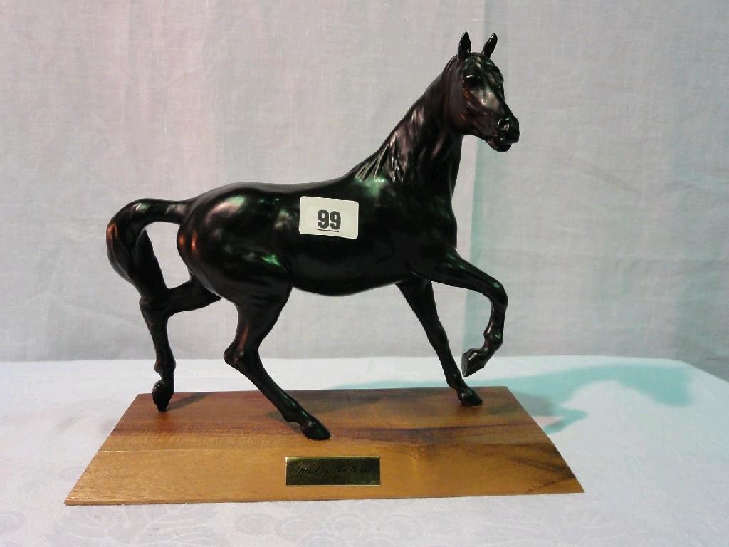 Appraisal: A Beswick matt glazed model of a trotting black horse