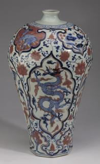 Appraisal: Chinese dragon and phoenix vase h Chinese blue and iron