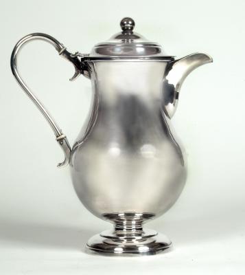 Appraisal: A GEORGIAN HOT WATER JUG of baluster form with scroll