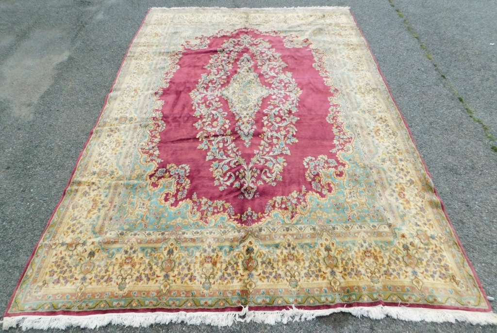 Appraisal: LG RED BOTANICAL RUG Middle East th CenturyBlue green cream