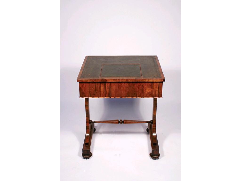 Appraisal: A REGENCY ROSEWOOD WRITING TABLE the rectangular top with leather-lined