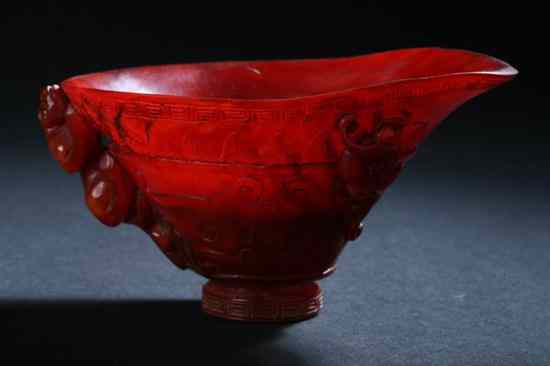 Appraisal: CHINESE HORN LIBATION CUP Carved to depict dragon in high