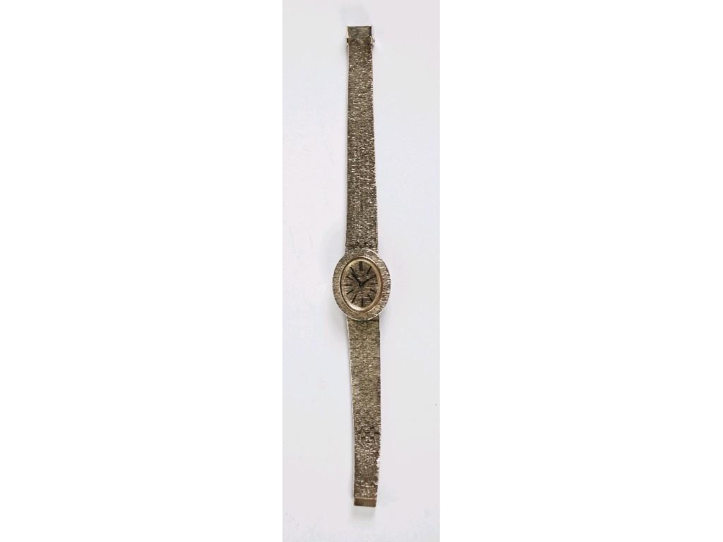 Appraisal: LADY'S BUECHE GIROD ct WHITE GOLD WRIST WATCH with bark