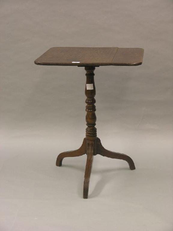 Appraisal: A Victorian oak tilt-top tripod table rectangular top on turned