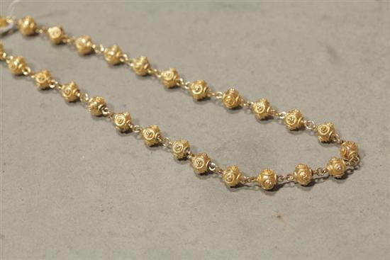 Appraisal: GOLD NECKLACE Round beads with applied wire decoration Clasp marked