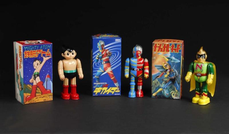 Appraisal: Lot of Tin Superhero Wind-Up Toys Description Japanese Made by