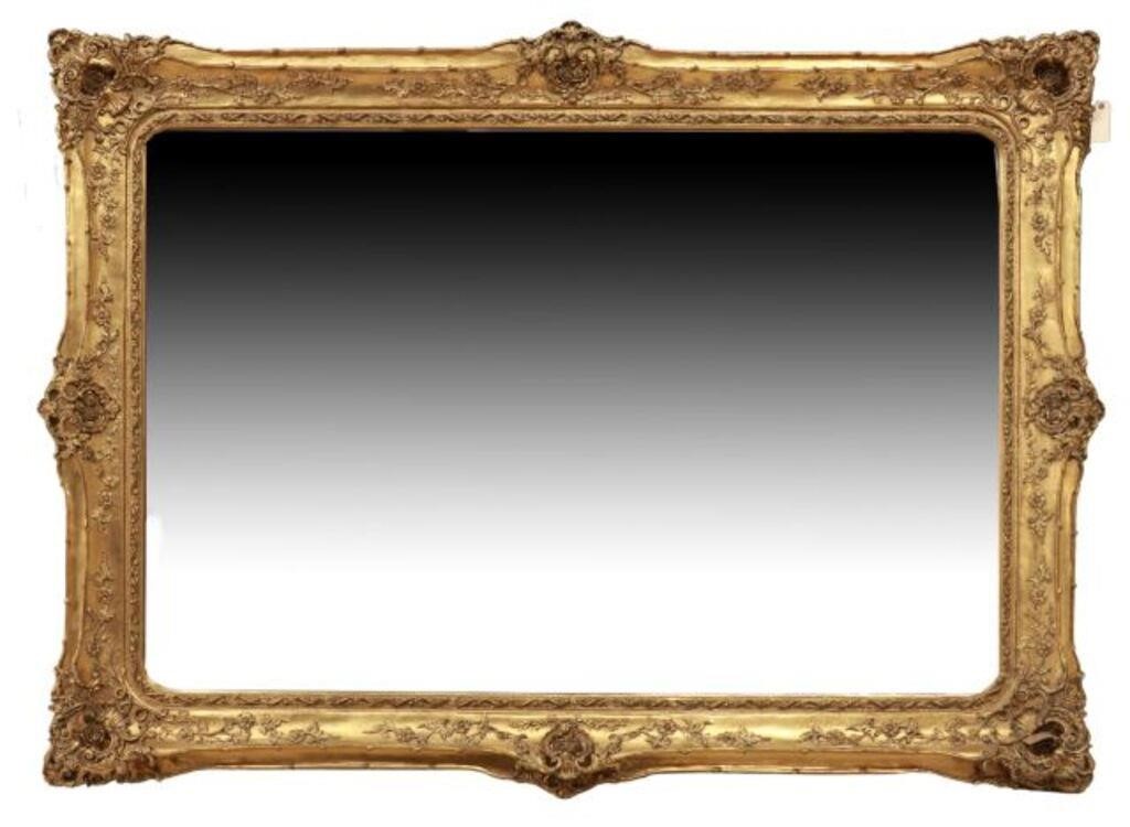 Appraisal: Monumental giltwood mirror late th c central shell and rosette