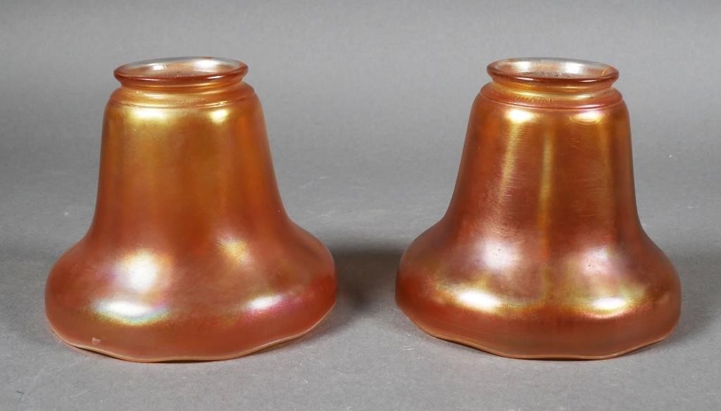 Appraisal: Pair iridescent orange glass lamp shades both marked NUART on