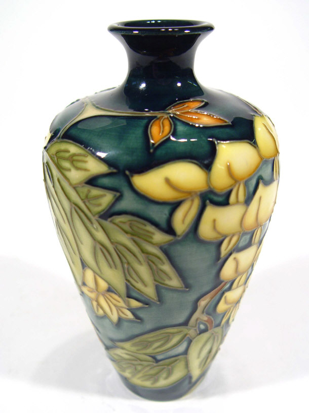 Appraisal: Moorcroft pottery vase hand painted and tubelined with flowers and