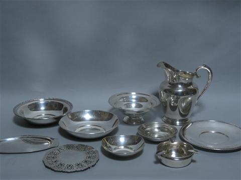 Appraisal: EIGHT AMERICAN SILVER SERVING PIECES Including a Wallace water pitcher