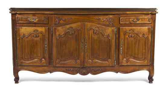 Appraisal: A Louis XV Provinicial Style Walnut Server having a serpentine