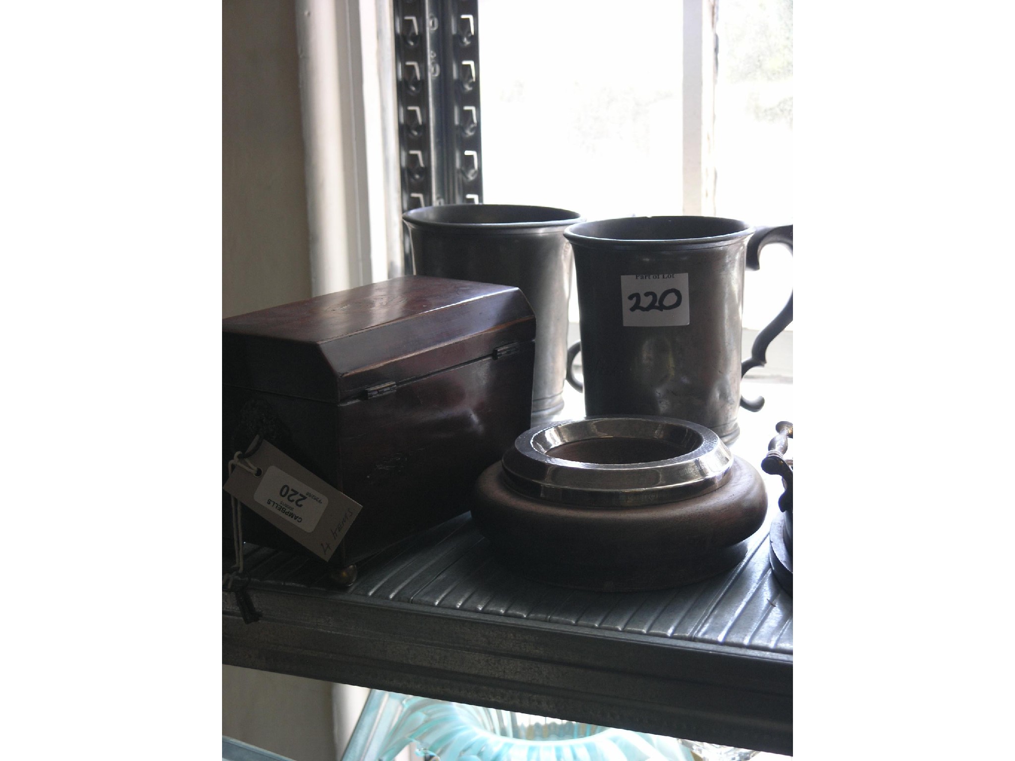 Appraisal: A Victorian mahogany tea caddy with key in silver-mounted wood