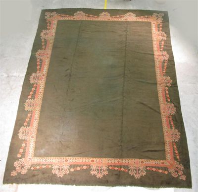 Appraisal: A large Donegal carpet with simple flower and tree border