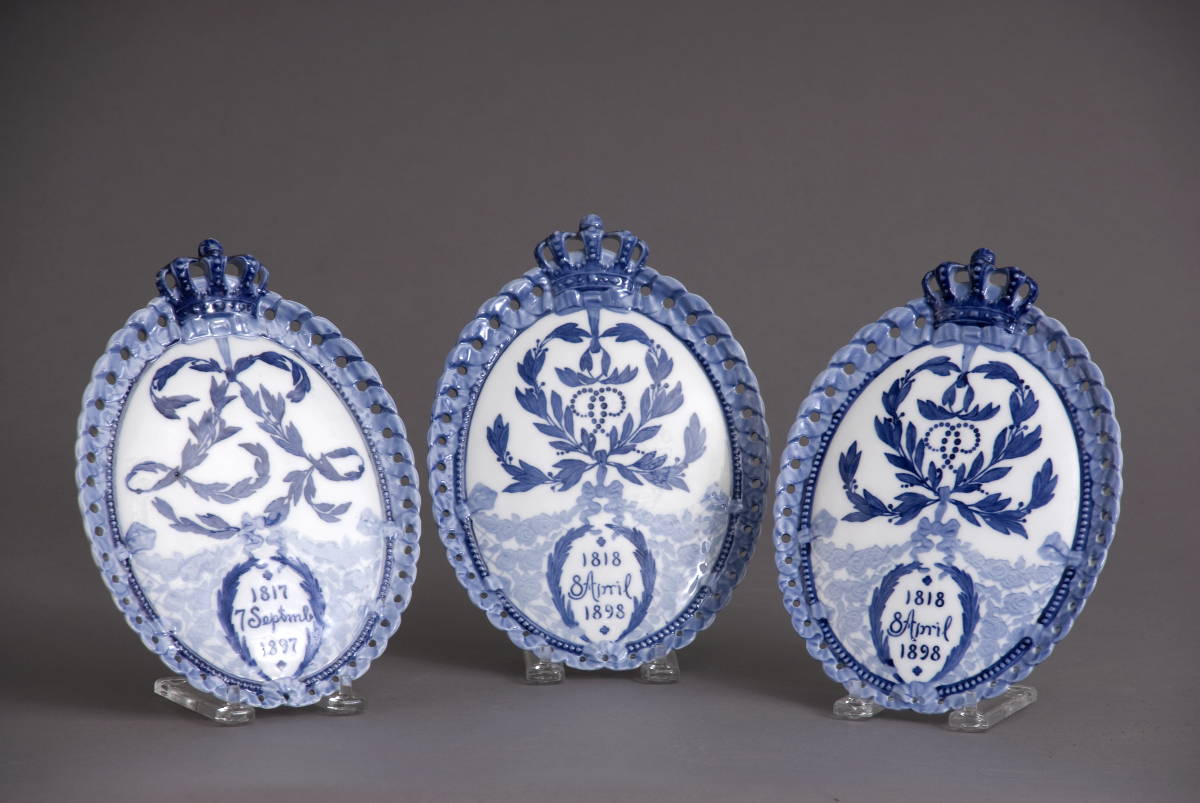 Appraisal: THREE ROYAL COPENHAGEN BLUE AND WHITE PORCELAIN AND PLAQUES COMMEMORATING