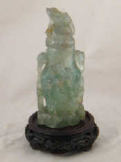 Appraisal: A Chinese carved green hardstone bottle with cover On carved