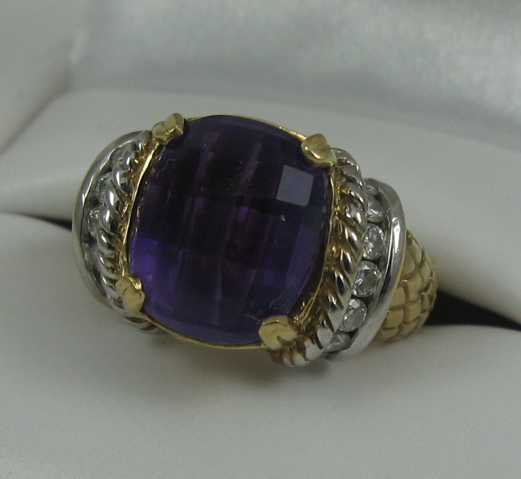 Appraisal: AMETHYST DIAMOND AND FOURTEEN KARAT GOLD RING centering a cushion