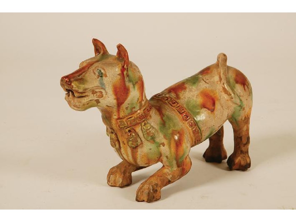 Appraisal: A CHINESE TILEWORKS FIGURE OF A CROUCHING HOUND splashed with