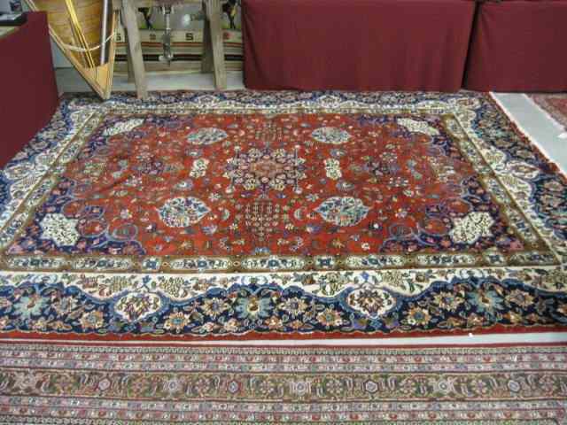 Appraisal: Tabriz Persian Room Size Rug wonderful florals primarly reds blues