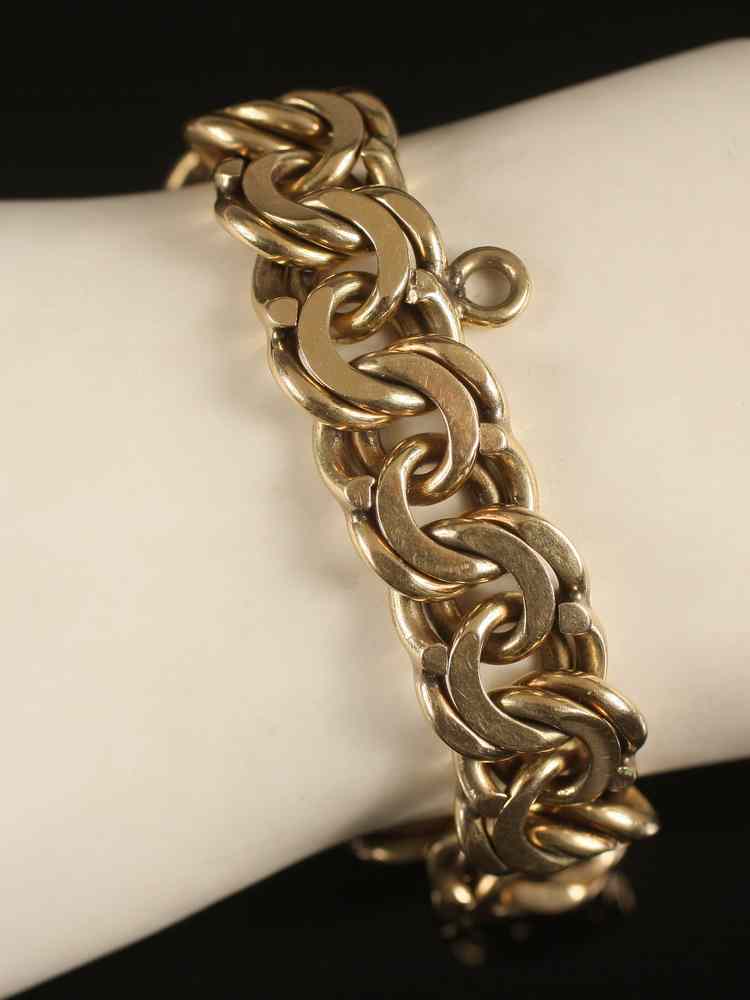 Appraisal: BRACELET - Vintage K yellow gold heavy charm bracelet style