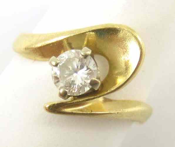 Appraisal: CHILD'S DIAMOND SOLITAIRE RING k yellow gold set with a