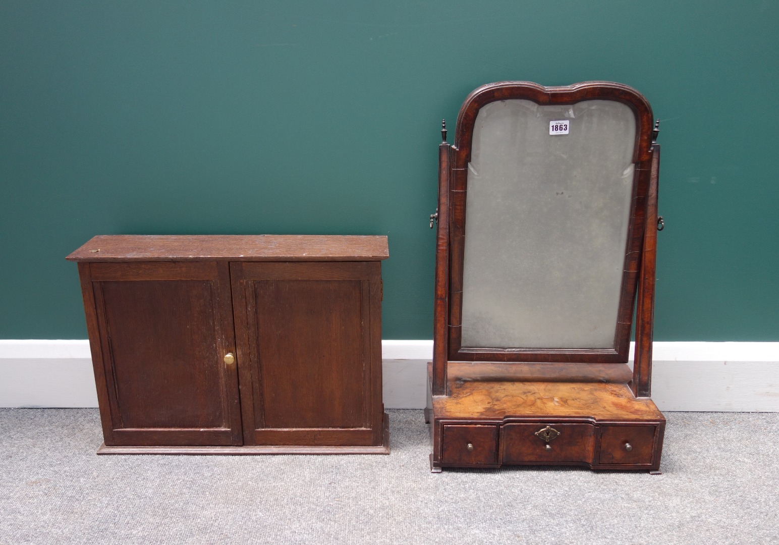 Appraisal: An th century walnut framed toilet mirror with shaped arch