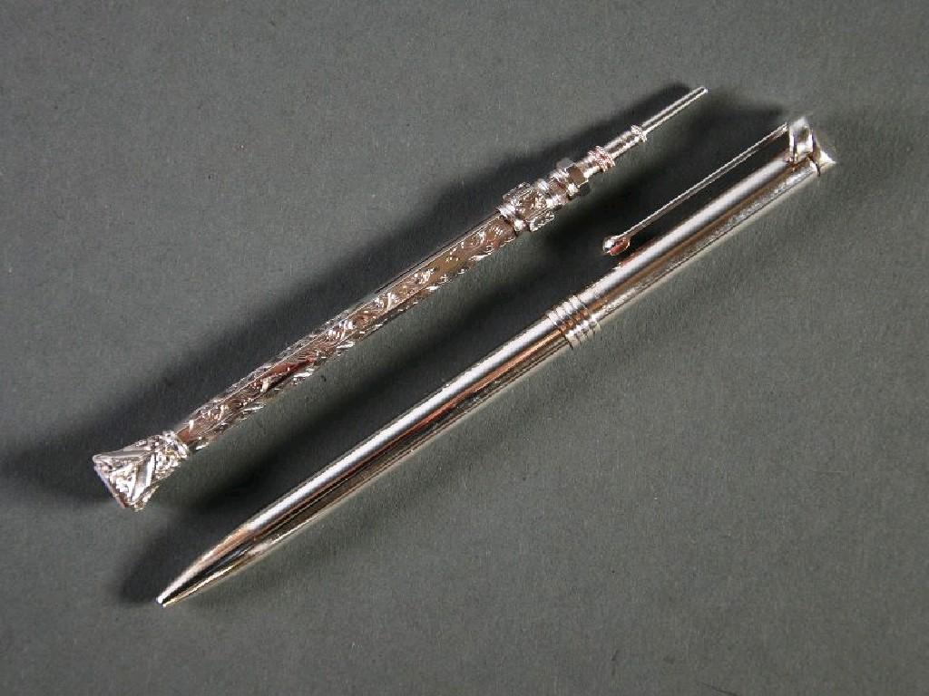 Appraisal: LATE VICTORIAN ENGRAVED SILVER PROPELLING PENCIL hexagonal with mauve coloured