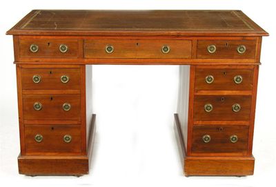 Appraisal: A mahogany twin pedestal desk with a gilt tooled leather